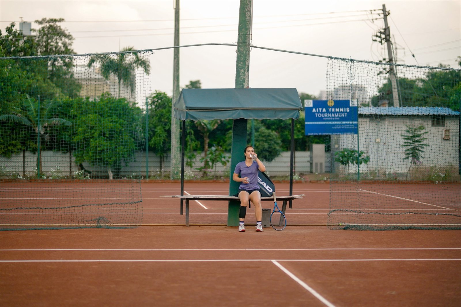 Tennis player hitting on a clay court